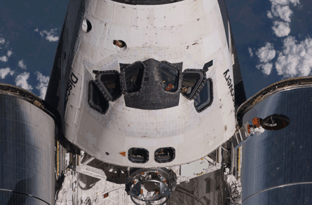 Space Shuttle Discovery docks with ISS for penulti