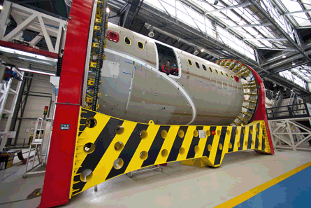 A 787 fuselage section under construction at Aleni