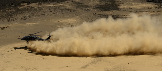 A HH-60 Pave Hawk Aircraft creates a dust cloud du